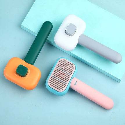 Self-cleaning pet grooming brush – in green, grey and pink
