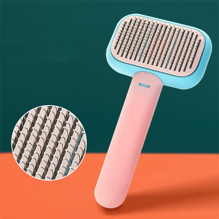 Self-cleaning pet grooming brush – pink with pins close-up